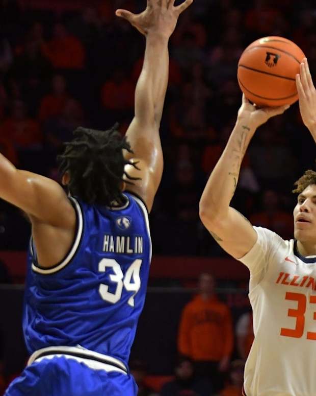 Nov 7, 2022; Champaign, Illinois, USA; Illinois Fighting Illini forward Coleman Hawkins (33) shoots the ball over Eastern Illinois Panthers forward Jermaine Hamlin (34) during the first half at State Farm Center. Mandatory Credit: Ron Johnson-USA TODAY Sports